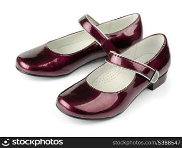 Red girls patent leather shoes isolated on white