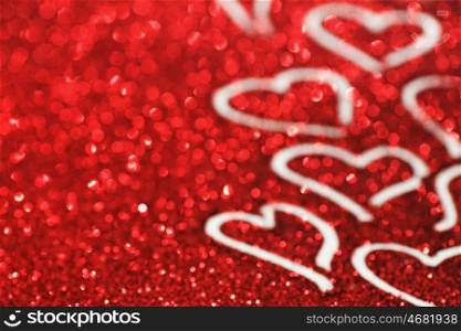 Red glitter background with hearts, valentines day design
