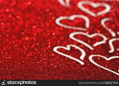 Red glitter background with hearts, valentines day design