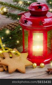 red glowing lantern. christmas red glowing lantern with evergreen tree and cookies
