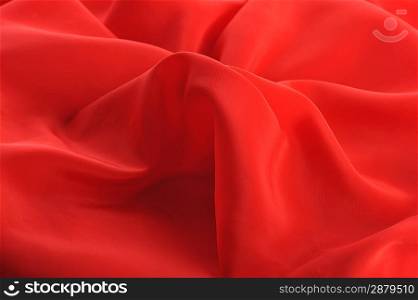 red graceful fabric close up, background