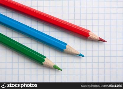 red green blue pencils and notebook