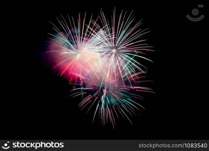 Red Green Sparkling Fireworks Background on Night Scene. Abstract color fireworks background and smoke on sky