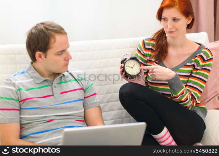 Red hair young woman hinting to boyfriend it&rsquo;s time to spend time with her