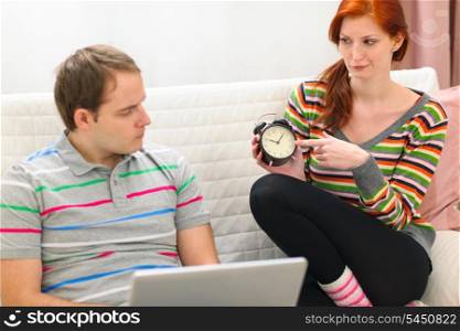Red hair young woman hinting to boyfriend it&rsquo;s time to spend time with her