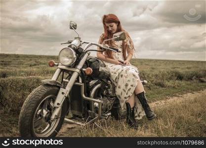 red-haired girl in a white dress and boots along with a motorcycle. lavender field