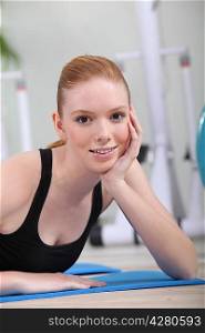 Red-haired girl in the gym
