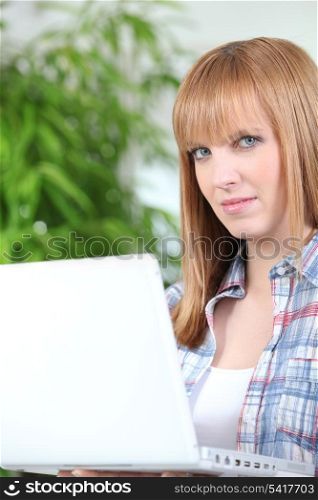 Red haired girl with laptop