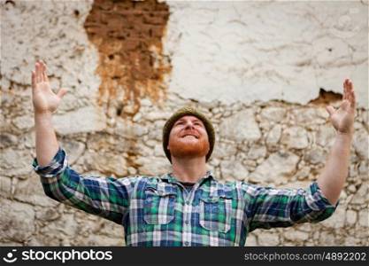 Red haired man with plaid shirt celebrating something