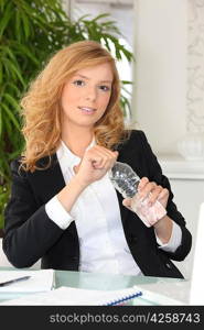 Red-haired woman with water bottle