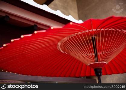 Red handmade paper umbrella in japan culture