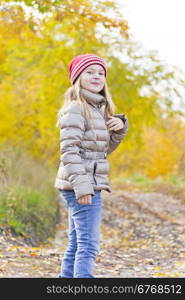 Red Hat girl on walk in autumn