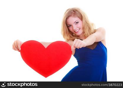 Red heart card. Love symbol. Portrait beautiful woman hold Valentine day symbol. Cute blonde girl in blue dress expressing tender feelings. Isolated studio shot
