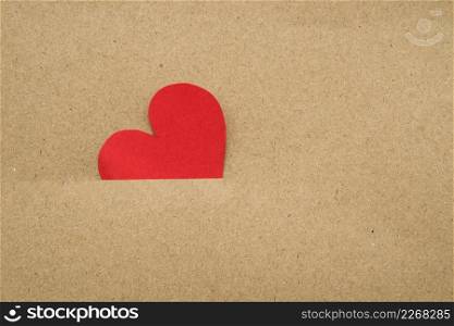 red heart inside cardboard