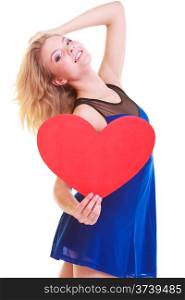 Red heart. Love symbol. Portrait beautiful woman hold Valentine day symbol. Cute blonde girl in blue dress expressing tender feelings. Isolated studio shot