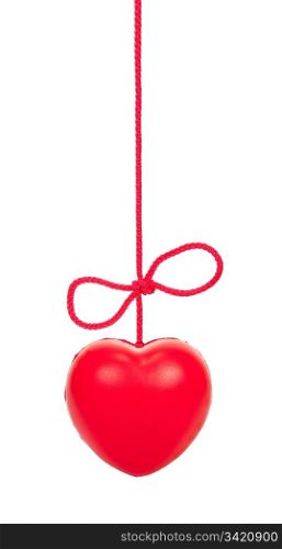 Red heart on a rope with a bow