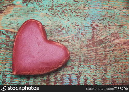 red heart on a wooden background