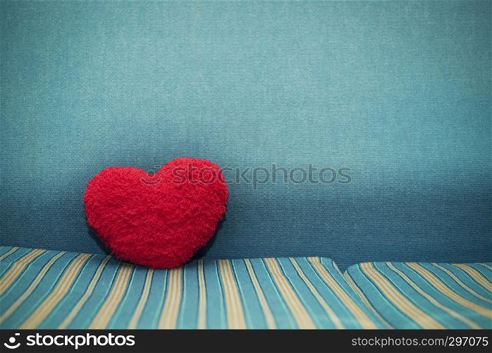 Red heart on floor with blue background. Love, wedding, valentine background concept.