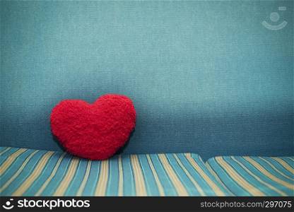 Red heart on floor with blue background. Love, wedding, valentine background concept.