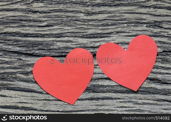 Red Heart paper on the wooden floor and have copy space for design in your love or Valentine day Concept.