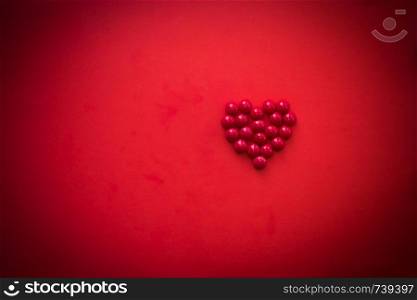 Red heart shape decoration on red background. Love, Wedding, Romantic and Happy Valentines day holiday concept. Sweets. Free space for text. Red heart shape decoration background. Love, Wedding, Romantic and Happy Valentine s day holiday concept. Sweets