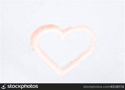 Red heart shape. Red heart shape drawing on white snow as love valentine background