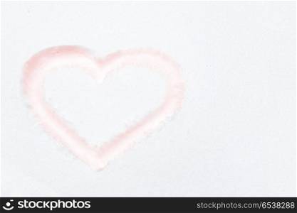 Red heart shape. Red heart shape drawing on white snow as love valentine background