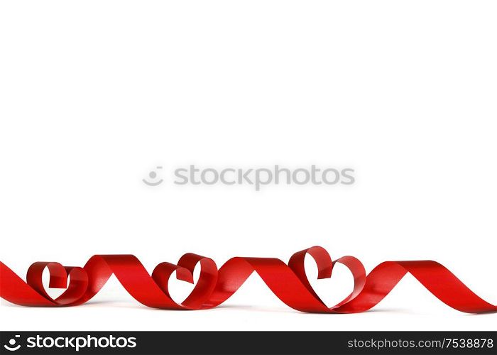 Red heart shaped ribbon isolated on white background Valentines day design. Red heart ribbon on white