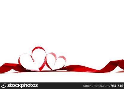 Red heart shaped ribbon isolated on white background Valentines day design. Red heart ribbon on white