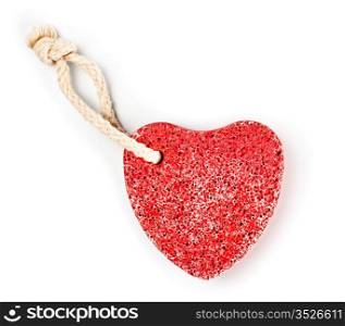 red heart-shaped stone with rope on white background