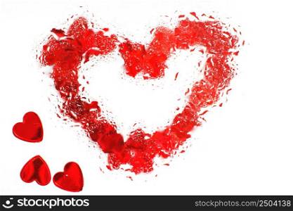 red heart under glass with water drops. abstract background with drops of water and painted heart on the surface. Valentines background, love, date concept. Red heart under glass surface with water drops close. Valentines background, love, date concept