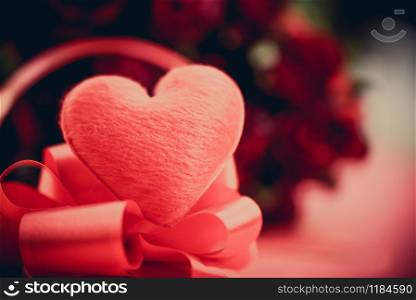 Red heart with flower roses bouquet on red background / heart on ribbon bow and rose romantic love valentine day concept
