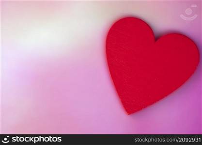 Red Heart with soft blurred pink background, Valentines Day concept, romantic greeting card Flat lay background with copy space space for text. Red Heart with soft blurred pink background, Valentines Day concept, romantic greeting card Flat lay background with copy space