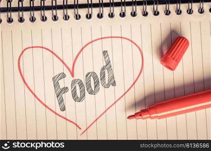 Red heart with the word food and a marker