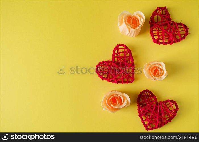 Red hearts and flowers on a yellow background, design postcard for Valentine&rsquo;s Day. Place for your text.. Red hearts and flowers on a yellow background, design for Valentine&rsquo;s Day.