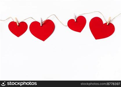Red hearts background with©space. Paper cut romantic concept, top view. Va≤nti≠s Day greeting card concept. White background. Red hearts background, paper cut romantic concept, top view