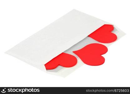 Red hearts in a paper envelope isolated over white background