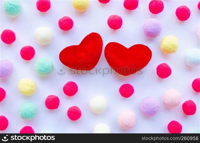 Red hearts, little colorful balls . Concept of Valentines Day on white background
