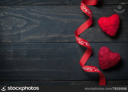 Red hearts made of wool on wooden background for Valentine&rsquo;s Day. Copy space. Top view