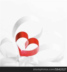 Red hearts of ribbon on white background