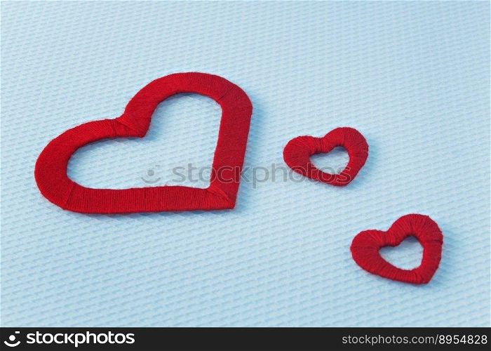 Red hearts on a blue background. Valentine’s Day. Valentines day greeting card.. Red hearts on a blue background. Valentine’s Day. Valentines day greeting card