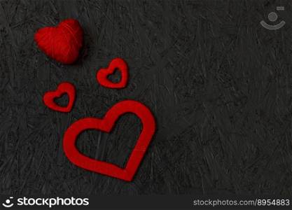 Red hearts on February 14, Valentine&rsquo;s Day on a black background. Valentines day greeting card. March 8. Red hearts on February 14, Valentine&rsquo;s Day on a black background. Valentines day greeting card