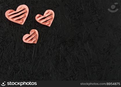 Red hearts on February 14, Valentine’s Day on a black background. Valentines day greeting card. March 8. Red hearts on February 14, Valentine’s Day on a black background. Valentines day greeting card