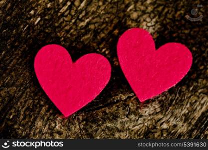 Red hearts stickers on wooden background