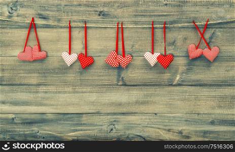 Red hearts. Valentines day background. Vintage style toned picture