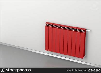 Red heating radiator attached on grey wall