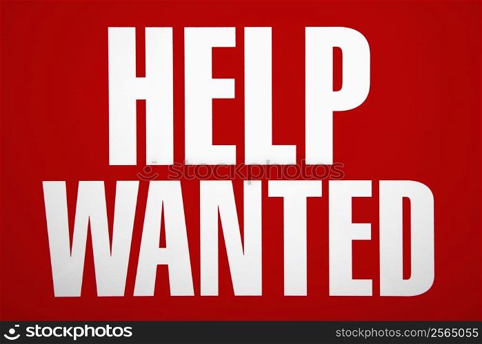 Red help wanted sign.