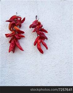 Red hot chili peppers hanging in Alpujarras of Granada facades to dry