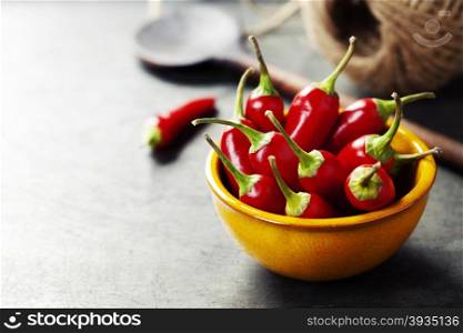 Red Hot Chili Peppers in bowl over vintage background