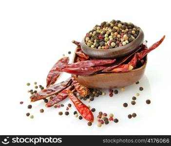 red hot pepper and peppercorn in a wooden bowls